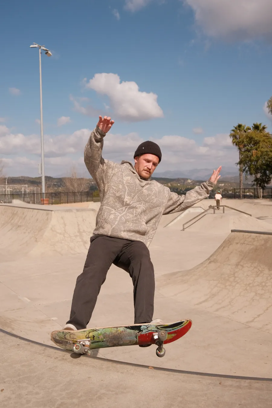 Skater in a Deadwood Camo Heavyweight hoodie